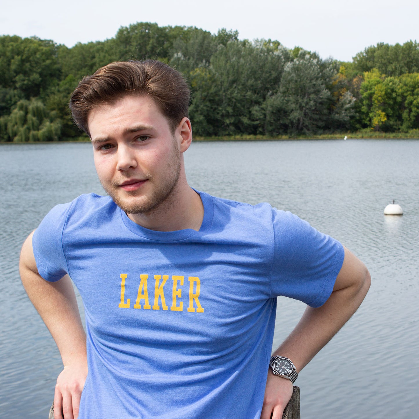 Man on lake wearing blue t-shirt with LAKER in yellow. Minneapolis Lakers, basketball, 1950's, minnesota, twin cities, minneapolis, st paul, minnesota-themed clothing, clothing, apparel, accessories, gifts, goods, t-shirt, t shirt, tee, t-shirts, t shirts, tees