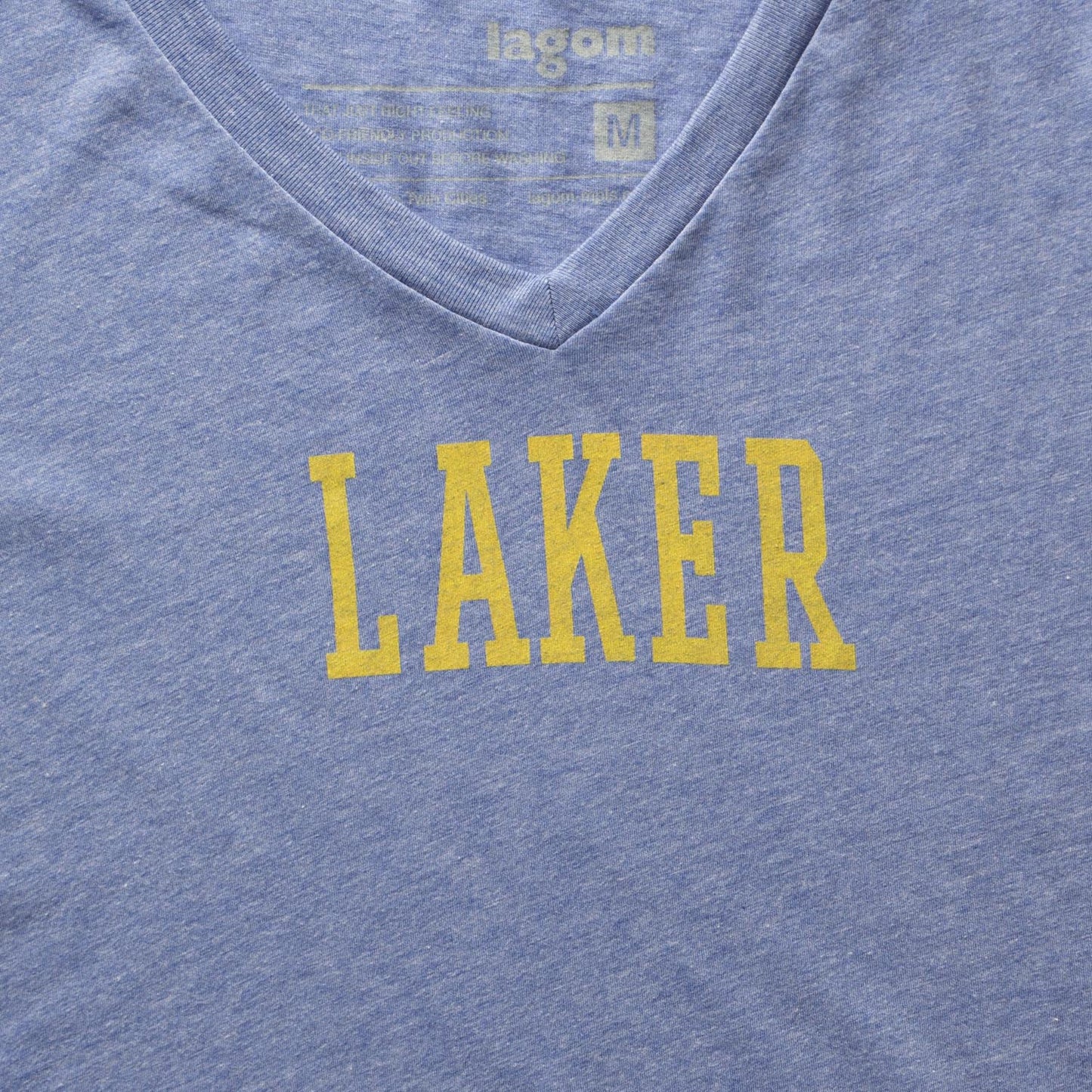 Details of blue t-shirt with LAKER in yellow. Minneapolis Lakers, basketball, 1950's, minnesota, twin cities, minneapolis, st paul, minnesota-themed clothing, clothing, apparel, accessories, gifts, goods, t-shirt, t shirt, tee, t-shirts, t shirts, tees