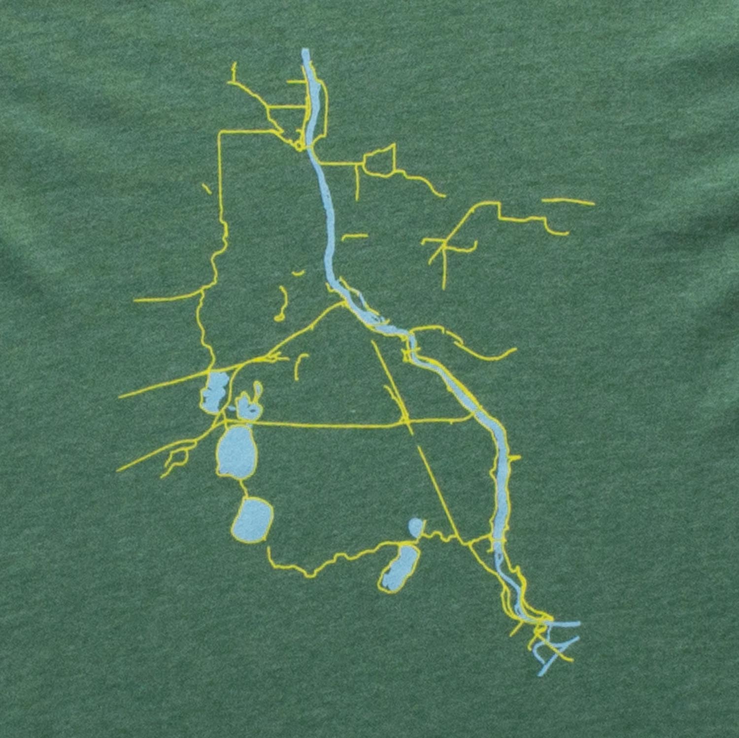 Details of green t-shirt with Minneapolis bike trails in yellow and lakes & rivers in blue, bike trails, biking, minnesota, twin cities, minneapolis, st paul, minnesota-themed clothing, clothing, apparel, accessories, gifts, goods, t-shirt, t shirt, tee, t-shirts, t shirts, tees