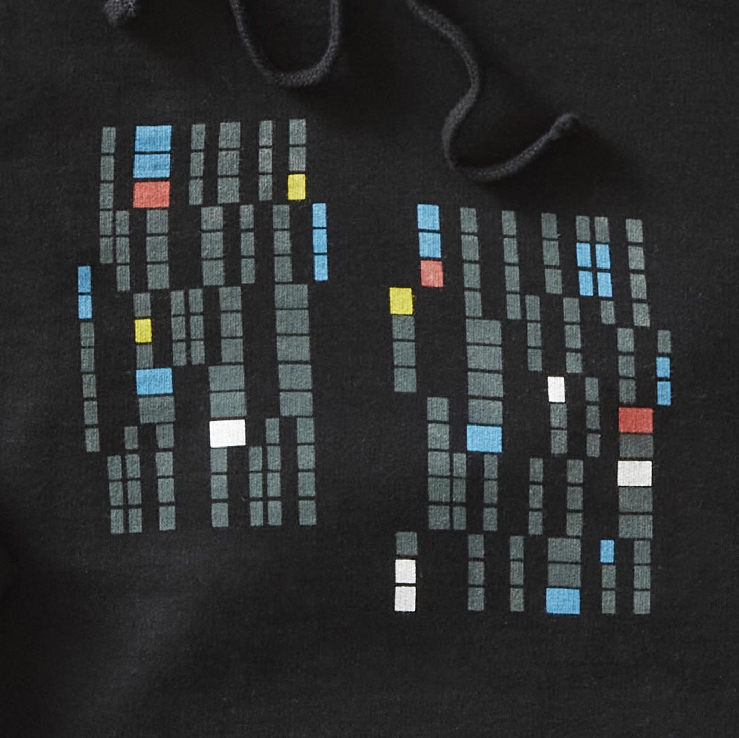 Detailed image of black pullover hoodie with rectangles in a variety of colors. minnesota, twin cities, minneapolis, st paul, minneapolis architecture, modern architecture, brutalism, cedar riverside plaza, minnesota-themed clothing, clothing, apparel, accessories, gifts, goods, hooded sweatshirt, hoodie, sweatshirts, hoodies
